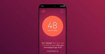 A smartphone screen displaying a TallyAge report showing “48 years & 11 months,” with a note that it’s younger than the person’s chronological age.