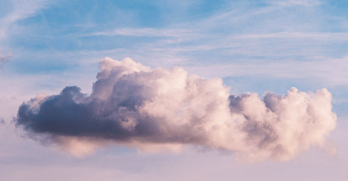 Soft, ethereal clouds against a blue sky.