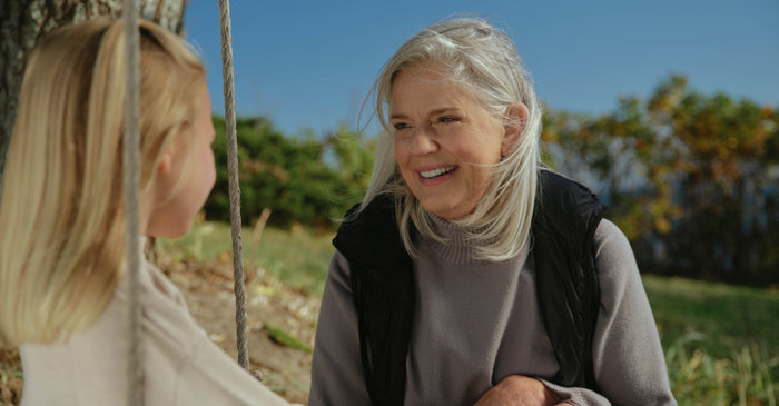 Grandparent playing with baby