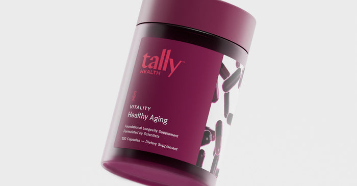 A slightly tilted product shot of a dark burgundy supplement bottle from Tally Health. The label reads 